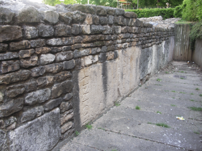 Late antique wall in Lugdunum (Lyon) containing earlier inscriptions as building material. © C. Witschel.